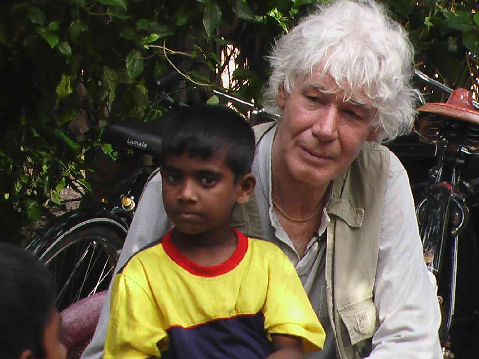 Paul van Vliet in Sri Lanka, with child